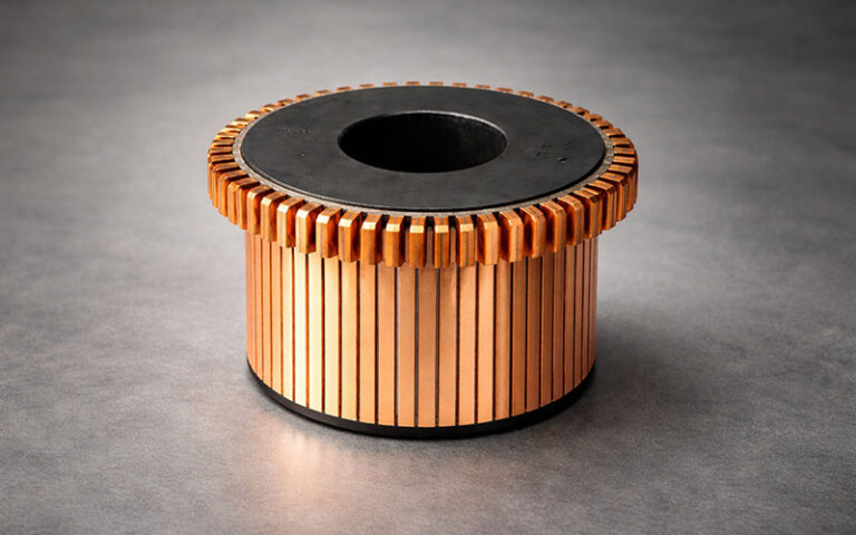 Close-up of polished copper commutator bars and mica insulation