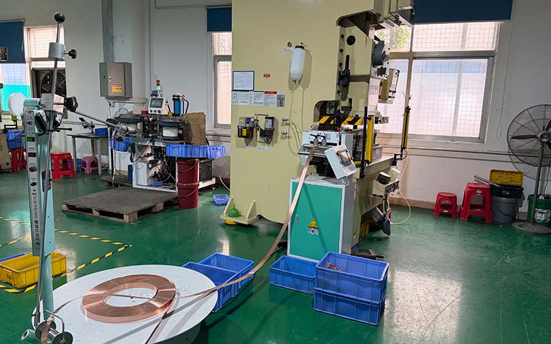 Copper commutator being machined on a lathe