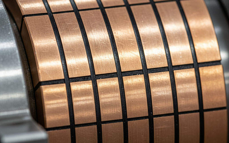 Macro view of copper commutator bars and mica.