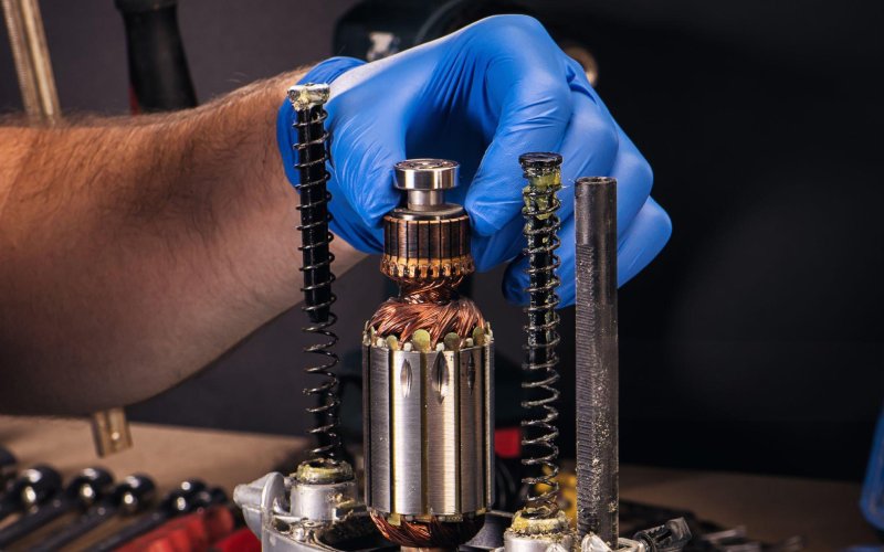 engineer adjusting motor commutator