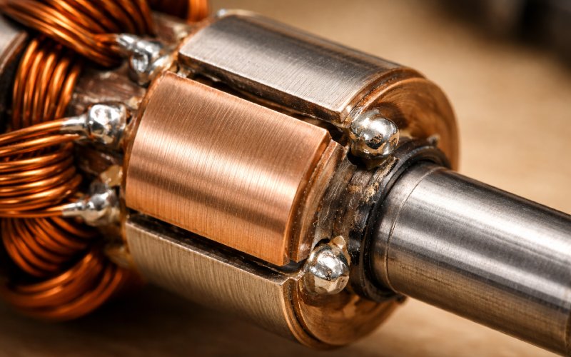 hand-fabricated two-segment copper commutator on a shaft