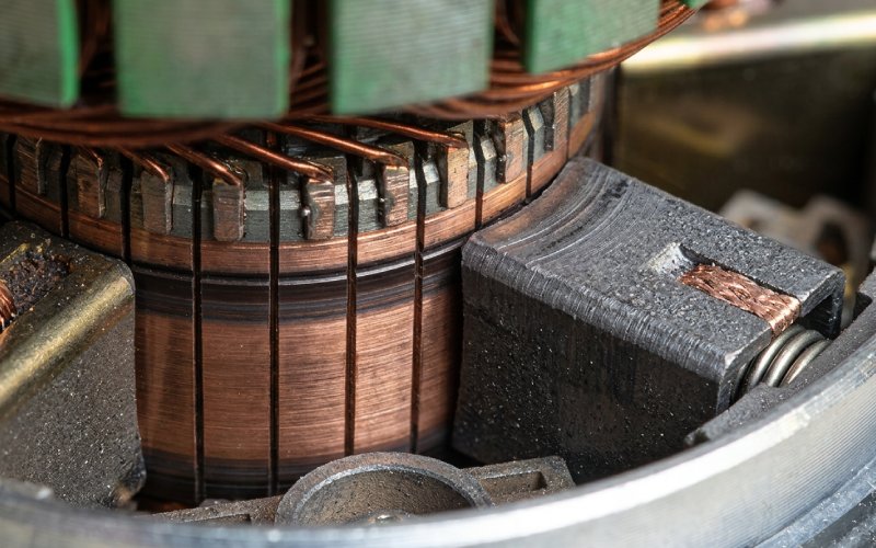 Macro view of the commutator and brush-contact region inside an electric motor